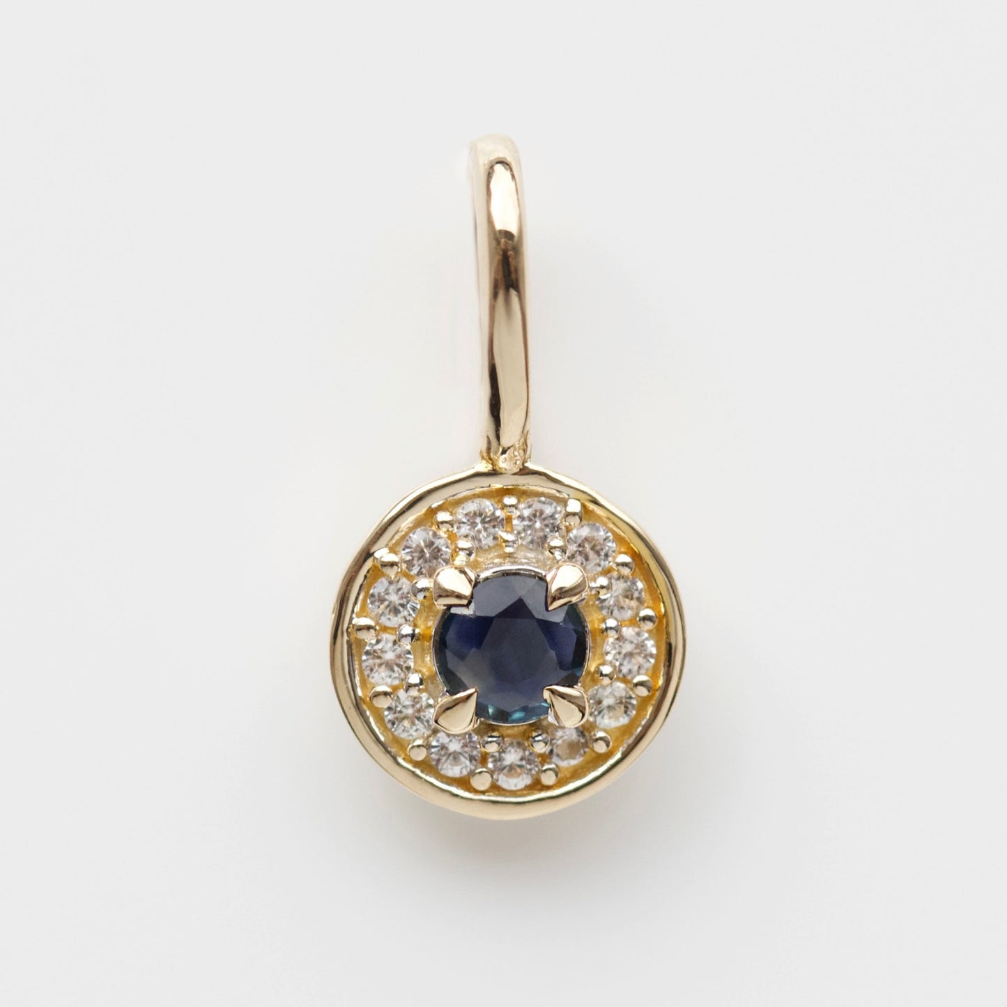 evil eye sapphire protection charm in solid gold