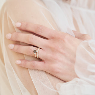 Moissanite and diamond wedding band in gold