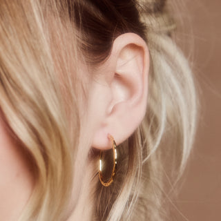 molten infinity hoop earrings