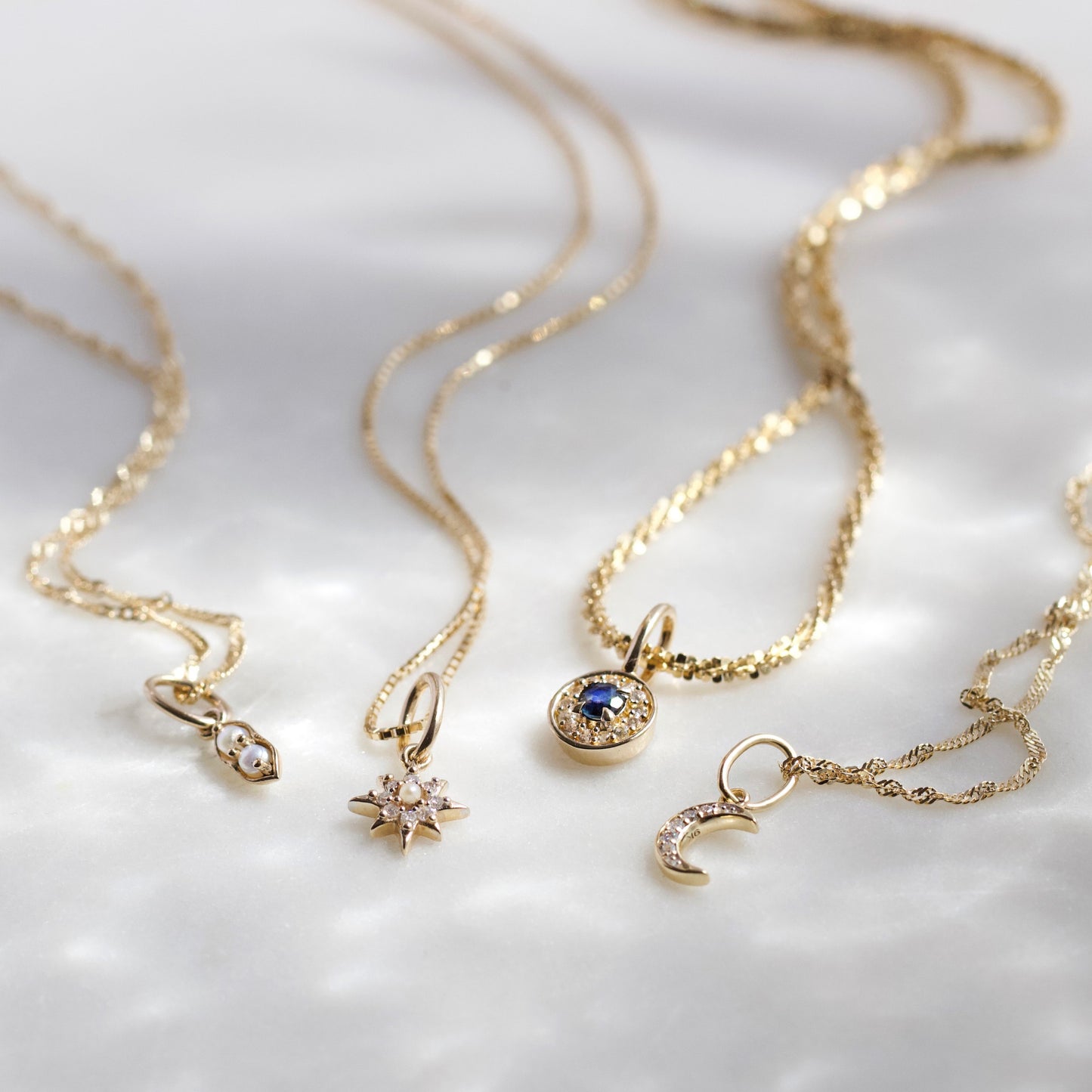 Crescent moon diamond charm in solid gold