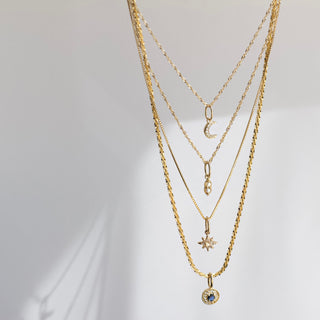 evil eye sapphire protection charm in solid gold