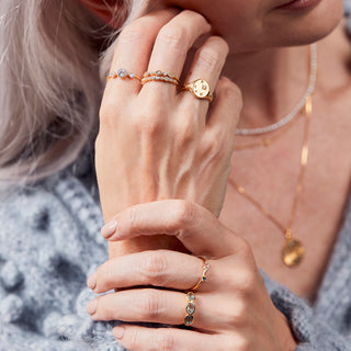 mixed stone and shape diamond and cz eternity ring in gold