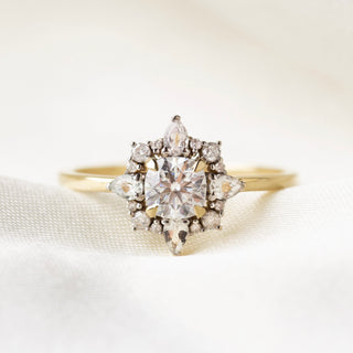 Moissanite, sapphire and diamond engagement ring in solid gold