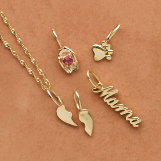 tourmaline heart in hands charm in solid gold