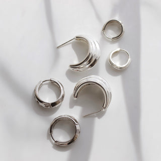 celestial rhodium plated tapered hoop earring with cz