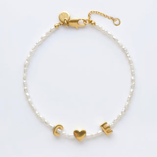 personalised pearl initial bracelet in gold