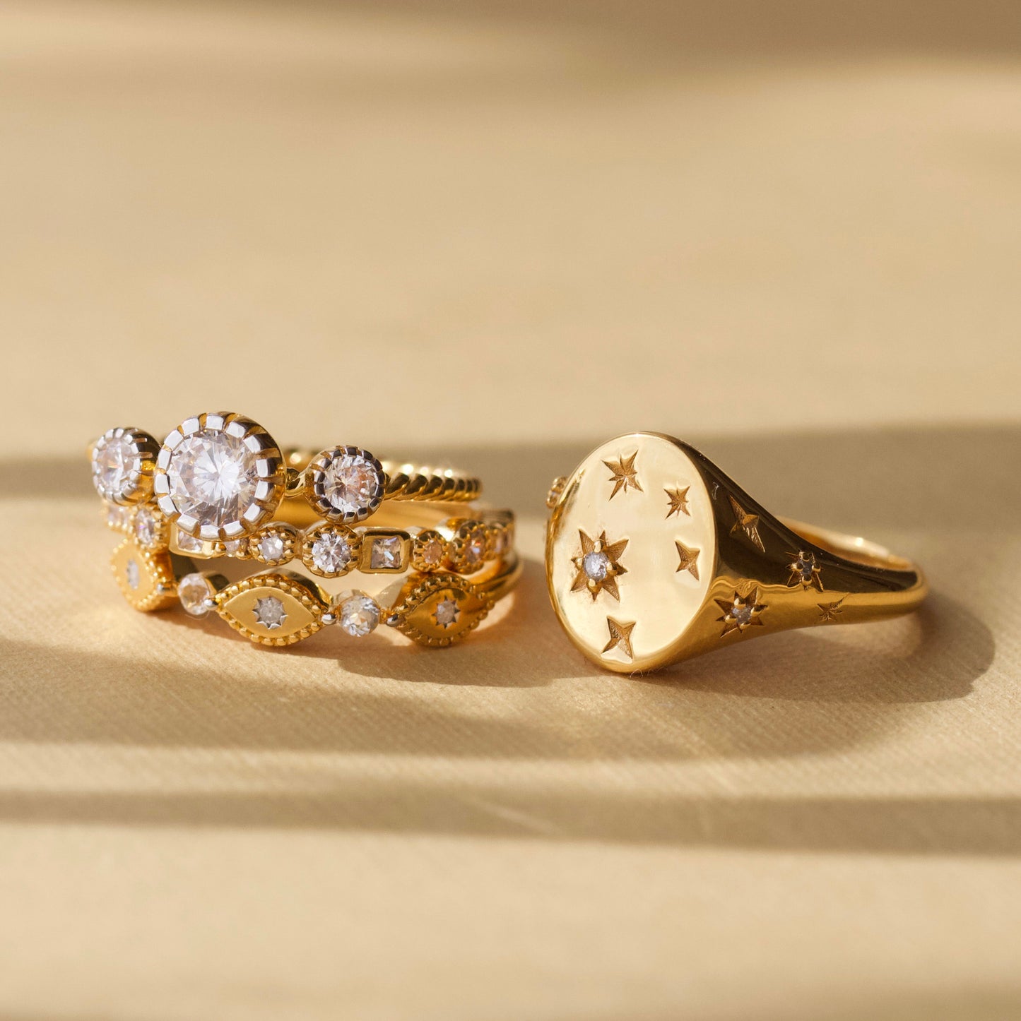 cz stone ring with twisted band detail in gold