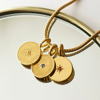 birthstone coin pendants in gold