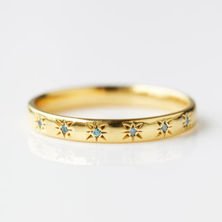 Blue diamond simple star set ring in gold