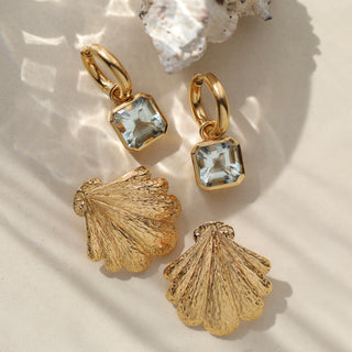 Statement shell stud earrings in gold