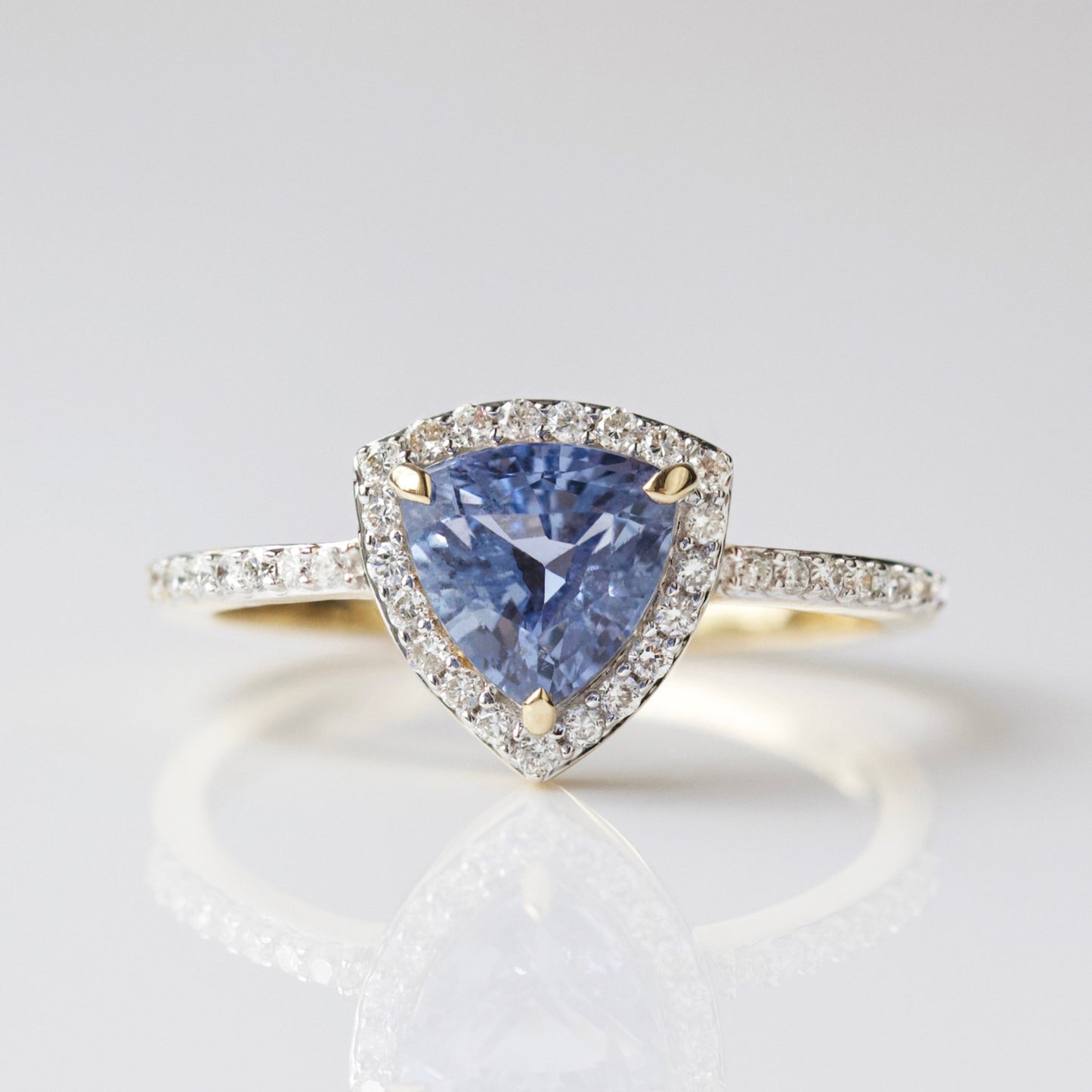 Exclusive blue sapphire and diamond engagement ring in solid gold