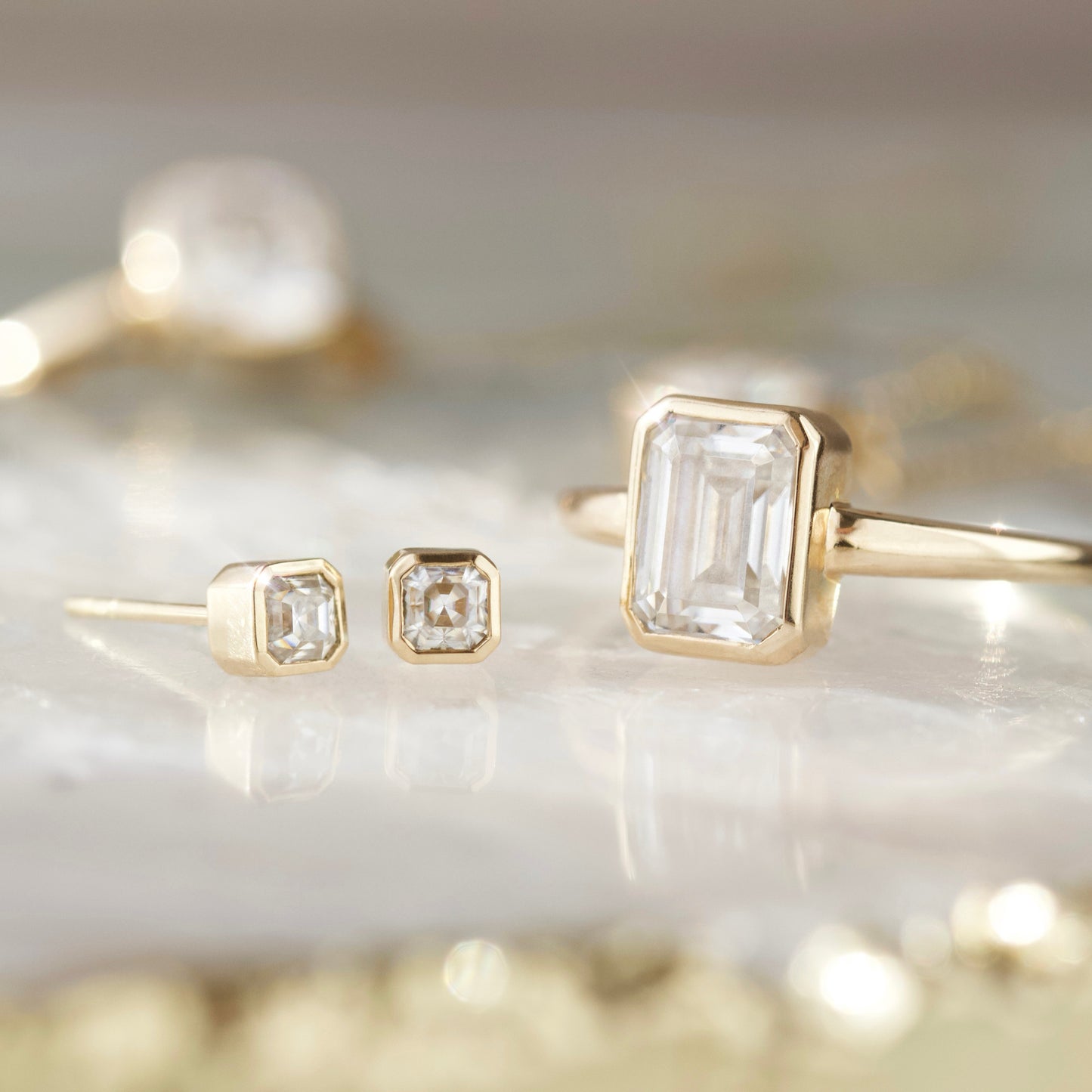 Carrie Elizabeth moissanite bezel set earrings in solid 9k gold