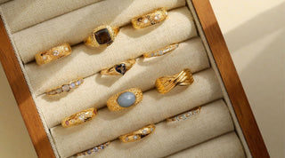 A collection of sample sale rings in a tray