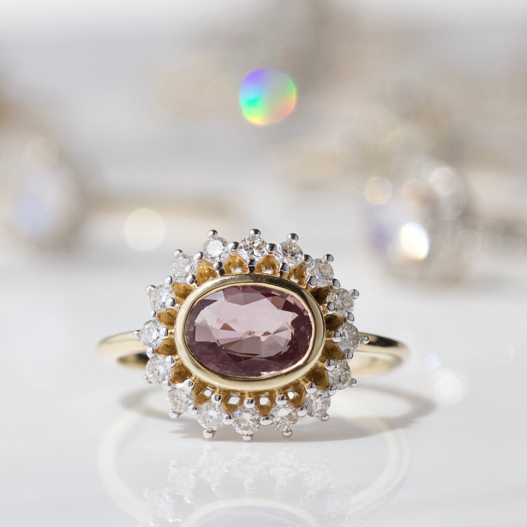 pink sapphire and diamond engagement ring in solid gold
