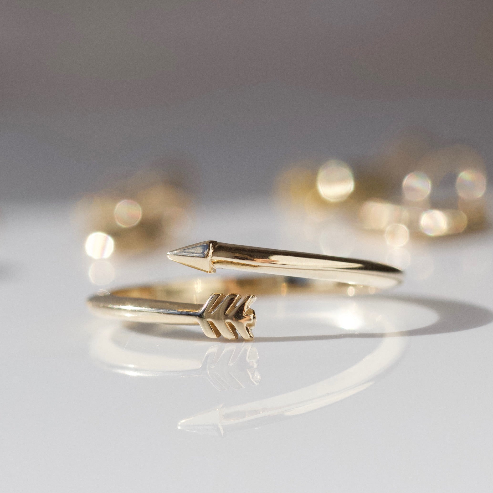 Solid gold cupids arrow ring 