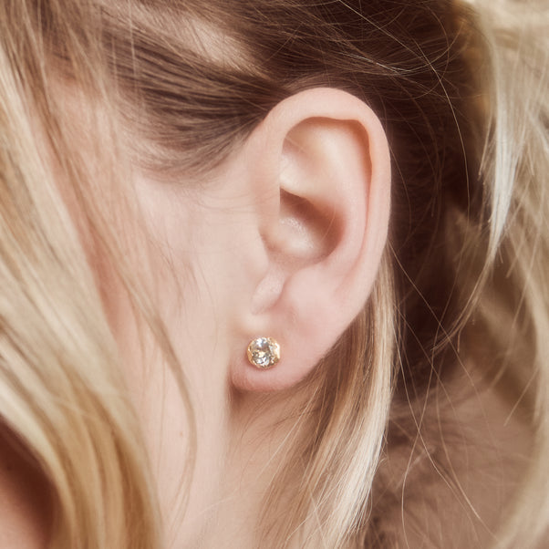 Molten green amethyst stud earrings in gold