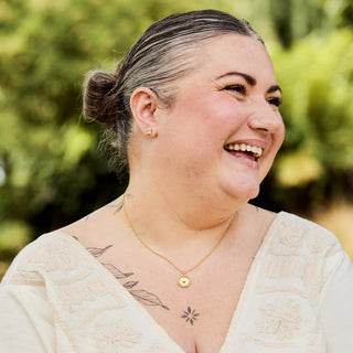 Carrie Elizabeth my safe space spinning necklace in gold 