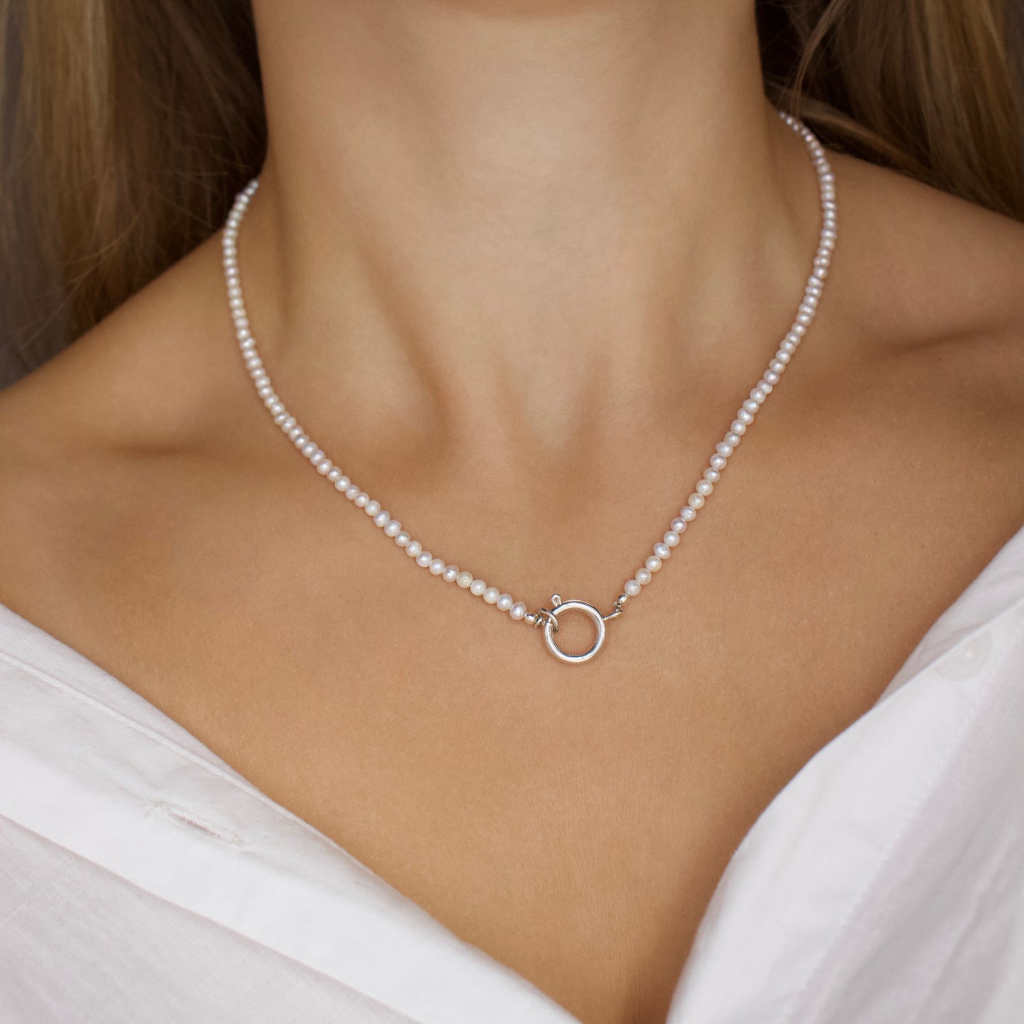 silver front facing pearl necklace