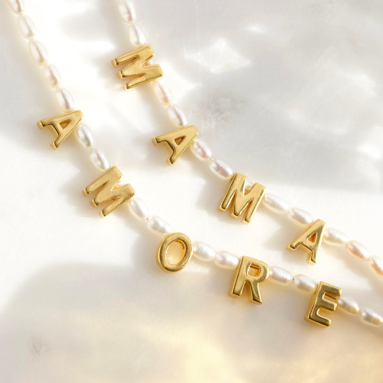 mama pearl word necklace in gold 