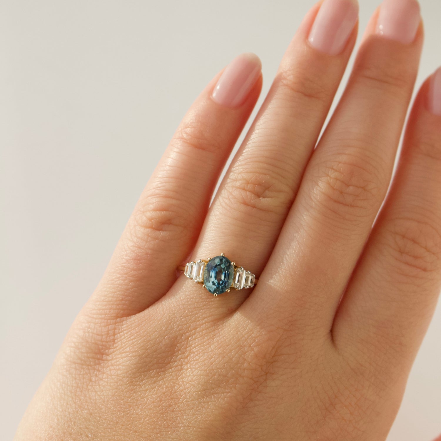 teal and white sapphire baguette ring in solid 14k gold