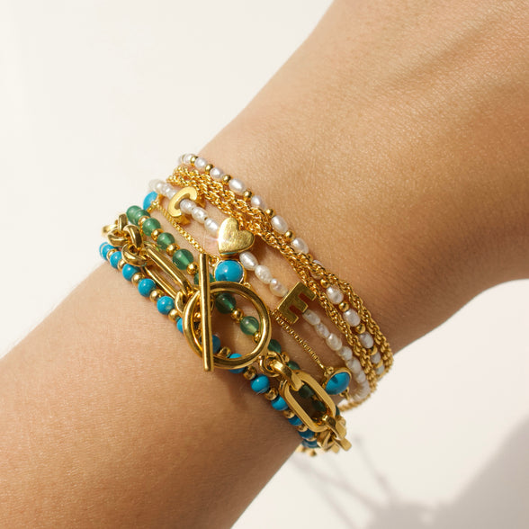 personalised pearl initial bracelet in gold