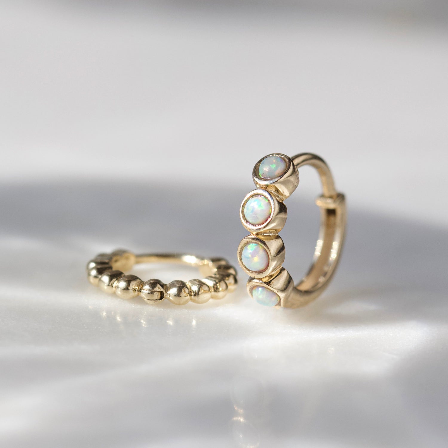 carrie elizabeth opal hoop earring in solid gold 