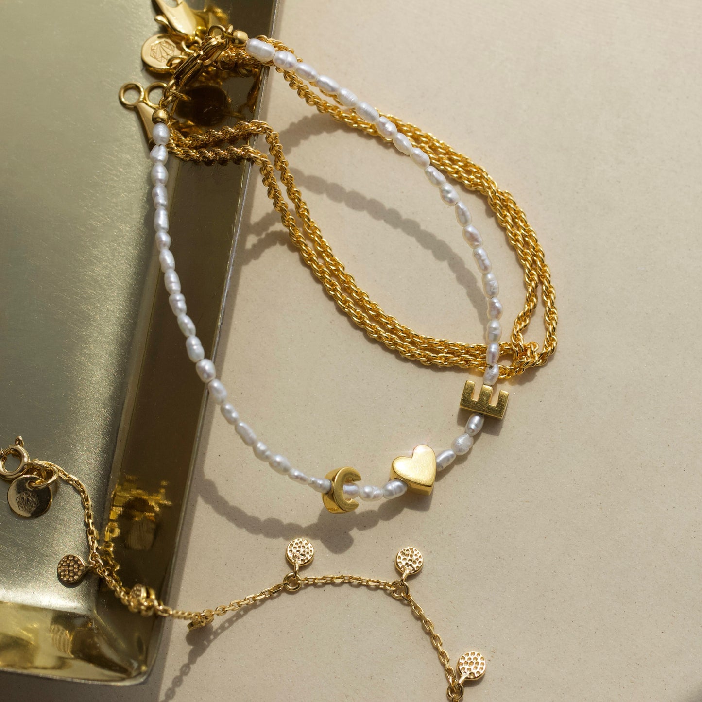 personalised pearl initial bracelet in gold