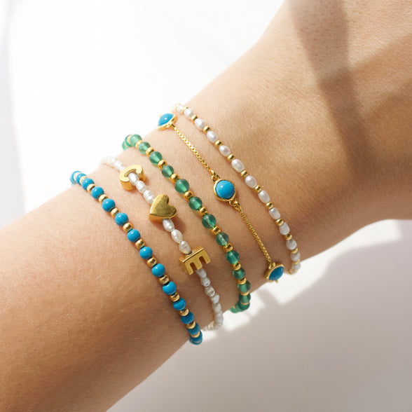 personalised pearl initial bracelet in gold