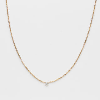 floating drilled diamond necklace in solid gold