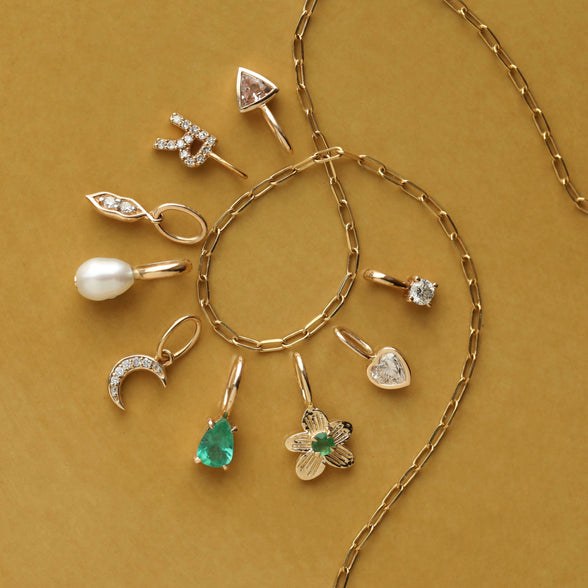 Diamond heart charm in solid gold