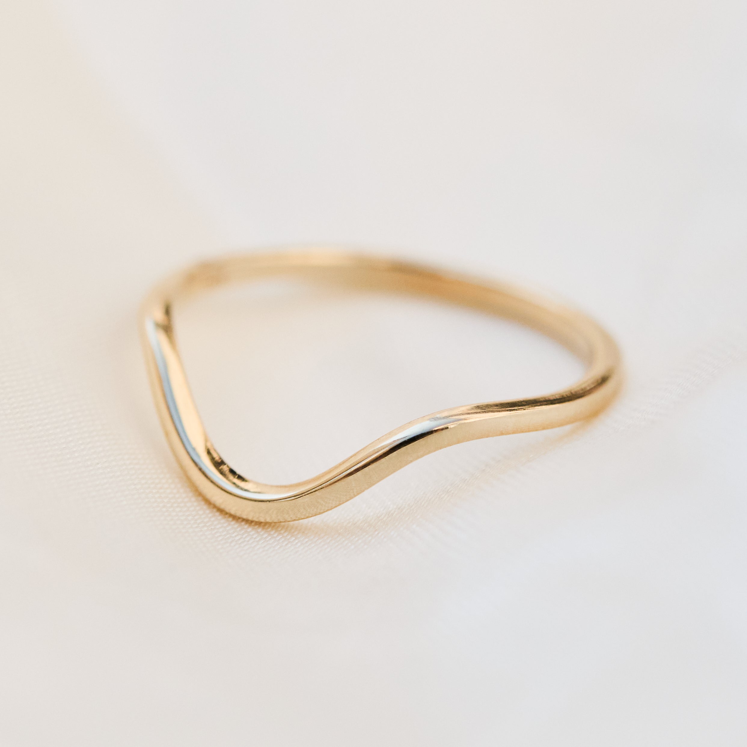 curved wedding ring in solid gold