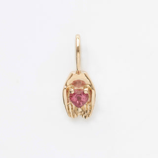 tourmaline heart in hands charm in solid gold