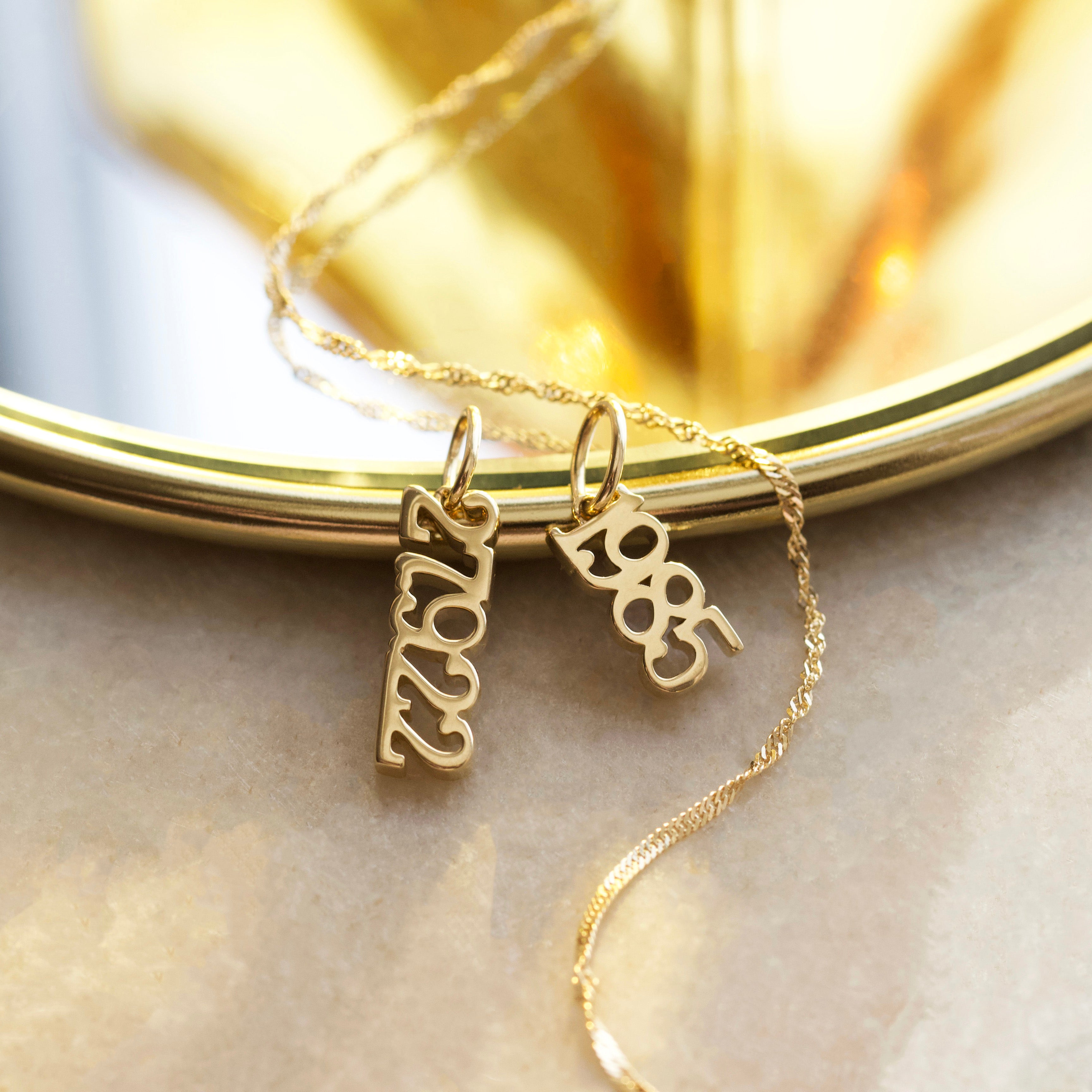 year charm solid 9k gold