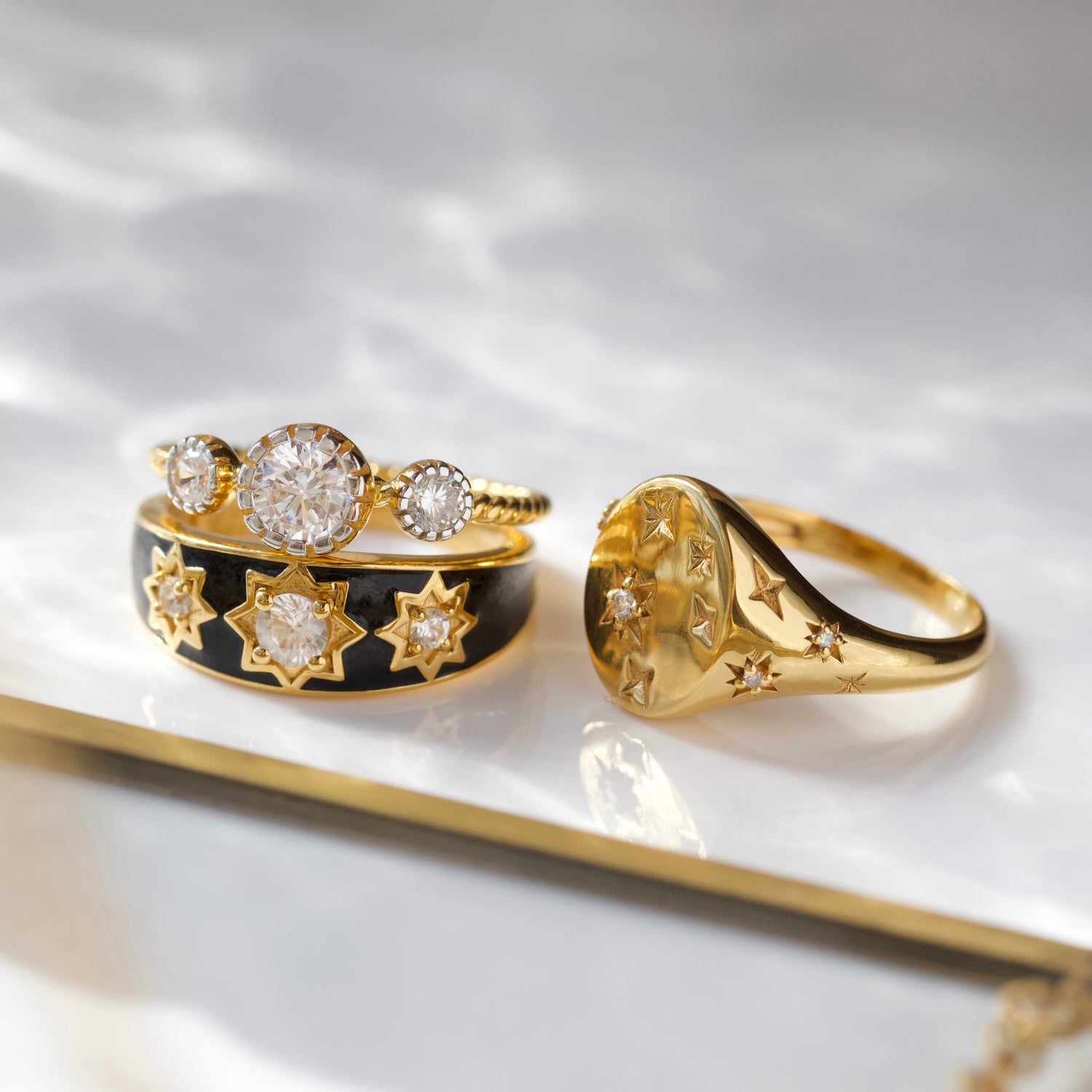 cz stone ring with twisted band detail in gold