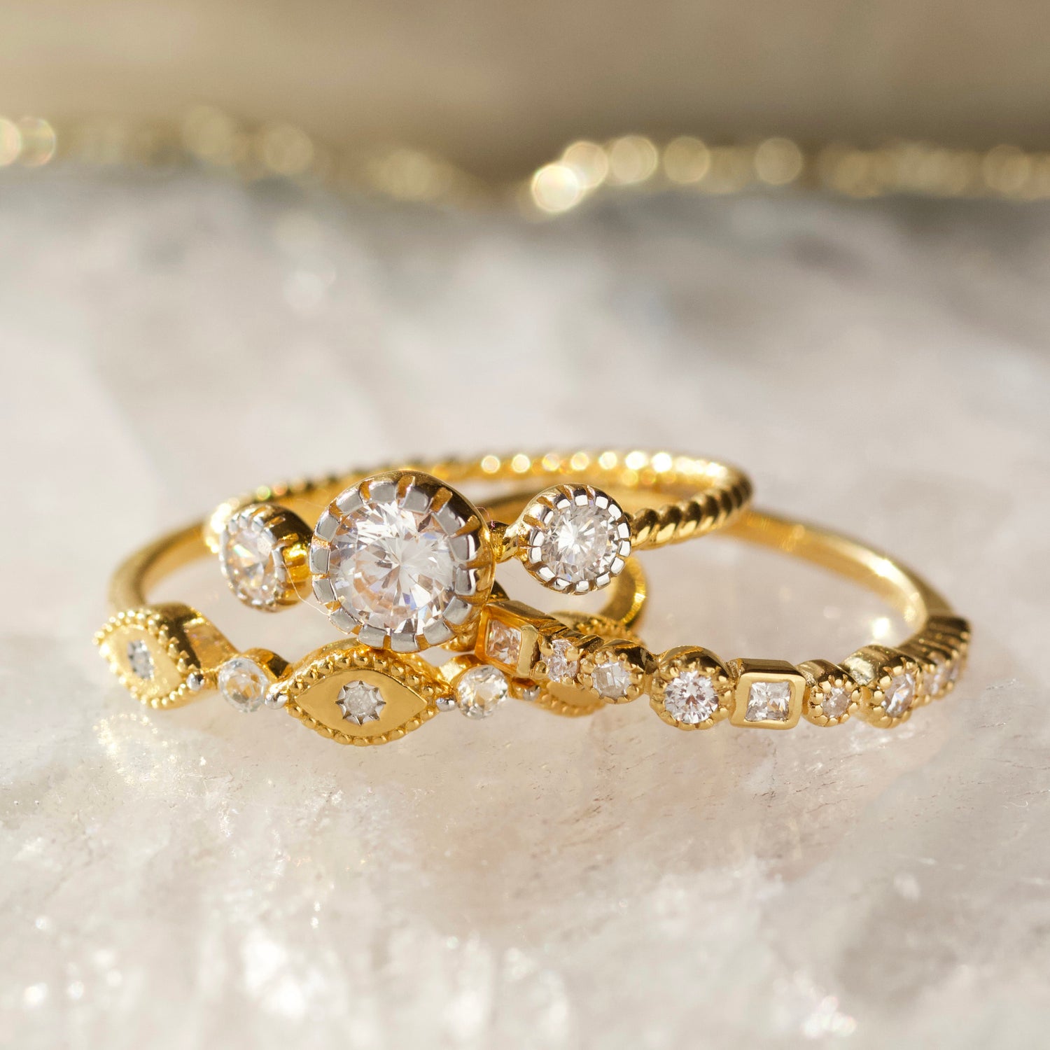 cz stone ring with twisted band detail in gold