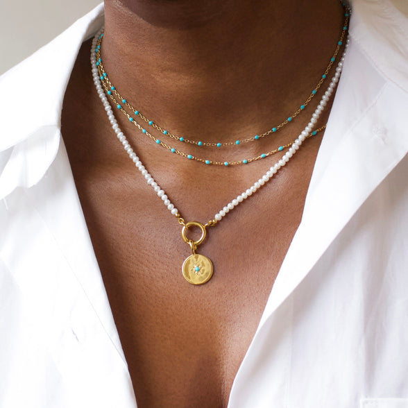 birthstone coin pendants in gold