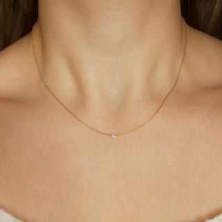 floating drilled diamond necklace in solid gold