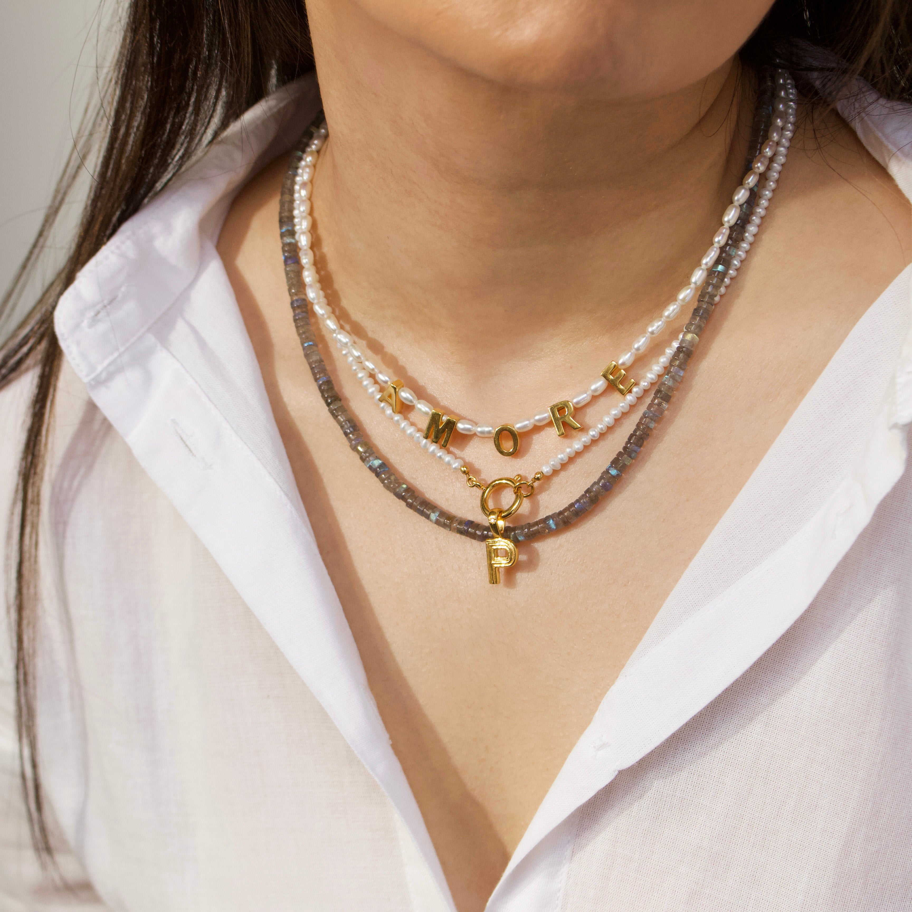 pearl and initial front facing necklace in gold with diamond