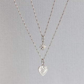 Diamond heart charm in white gold