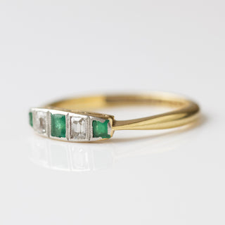 emerald and diamond vintage band ring in solid gold
