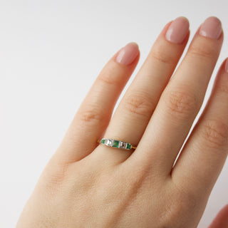 emerald and diamond vintage band ring in solid gold