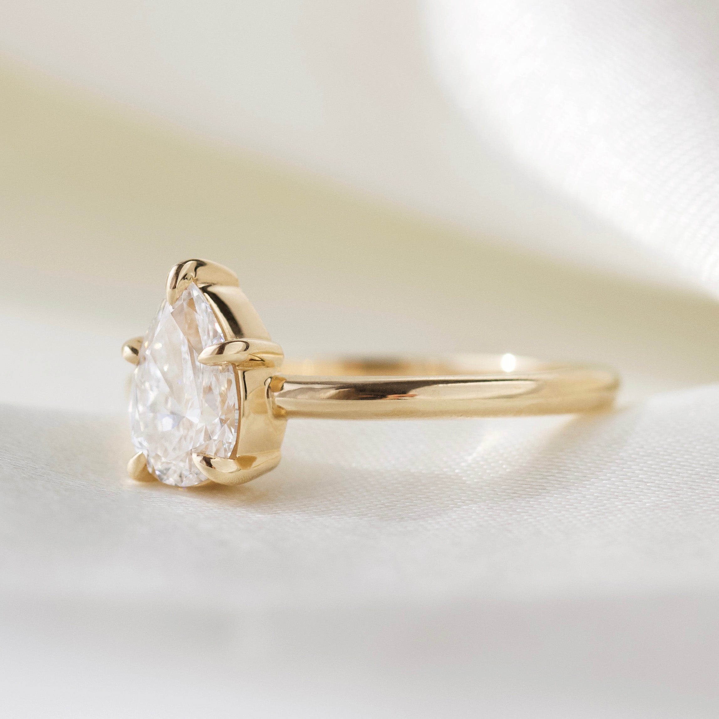 Pear Solitaire engagement diamond ring in solid gold