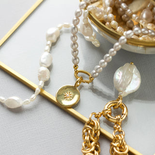 grey pearl sunray clasp necklace in gold
