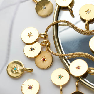 birthstone coin pendants in gold