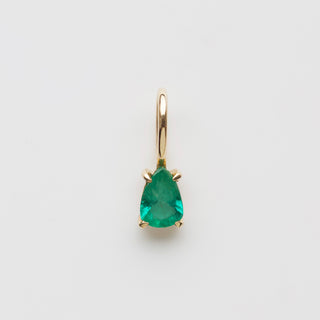 Emerald pear charm in solid gold