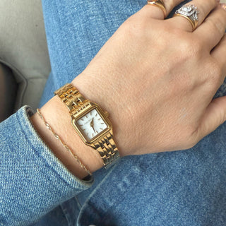 Gold square dial watch