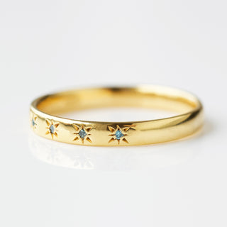 Blue diamond simple star set ring in gold
