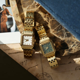 Gold watch white face