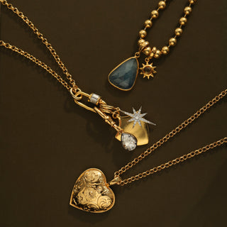 Gold heart pendant with engraved details
