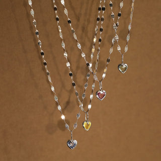 green heart charm on gold chain